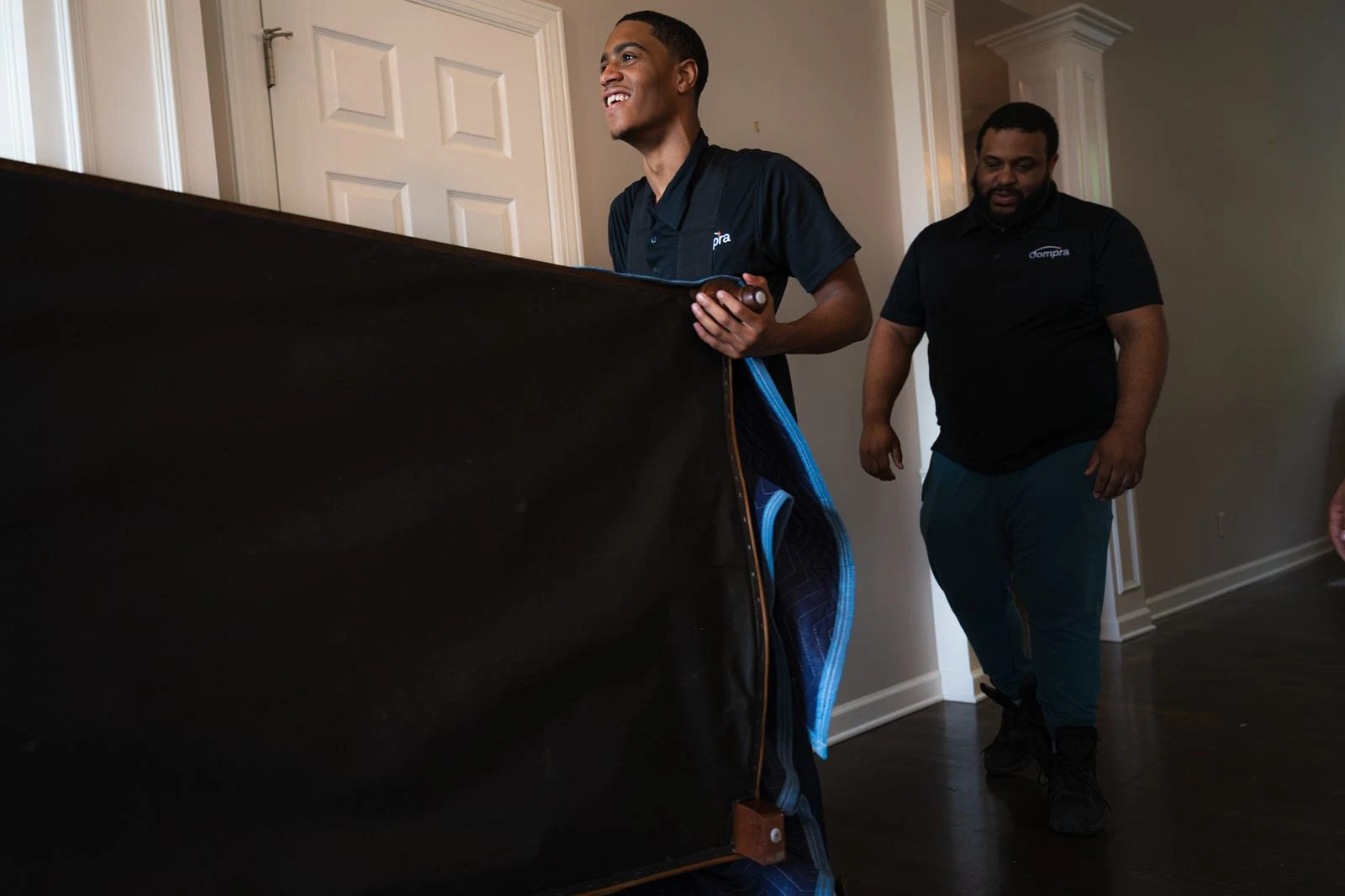 Crew assembling new furniture in living room